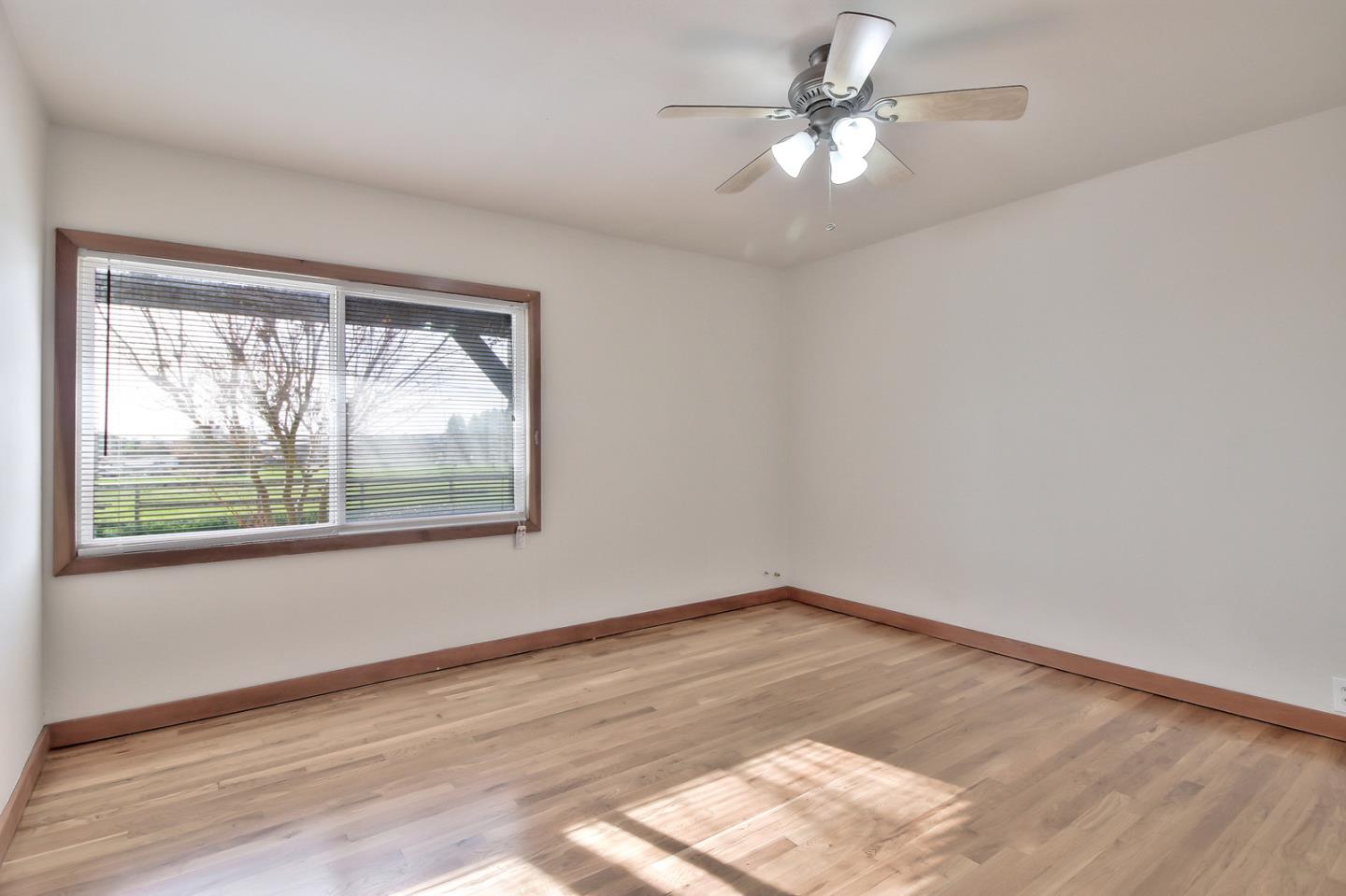 30 Heiner Road Watsonville, CA 95076 - Photo 15 of 50 a view of empty room with wooden floor and fan