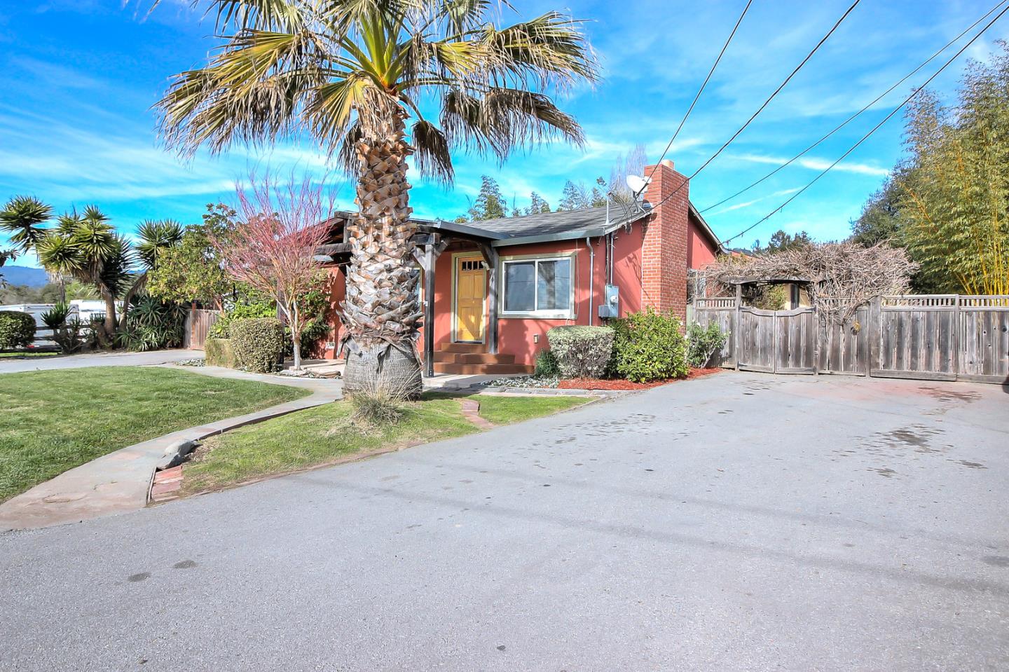 30 Heiner Road Watsonville, CA 95076 - Photo 3 of 50 a front view of a house with a yard and garage