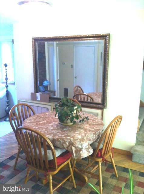 611 North Stuart Street Baltimore, MD 21221 - Photo 5 of 21 Dining Room with Wood Floors