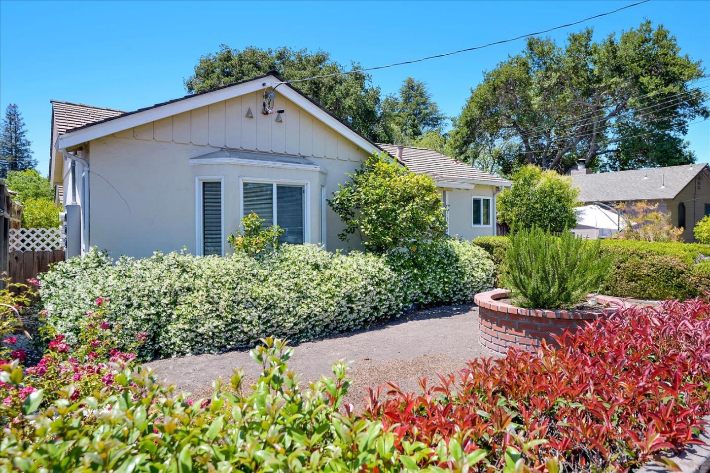 1357 Park Drive, Unit C Mountain View, CA 94040 - Photo 1 of 16 a front view of a house with a yard