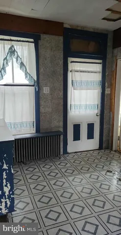 a view of a house with a wooden door