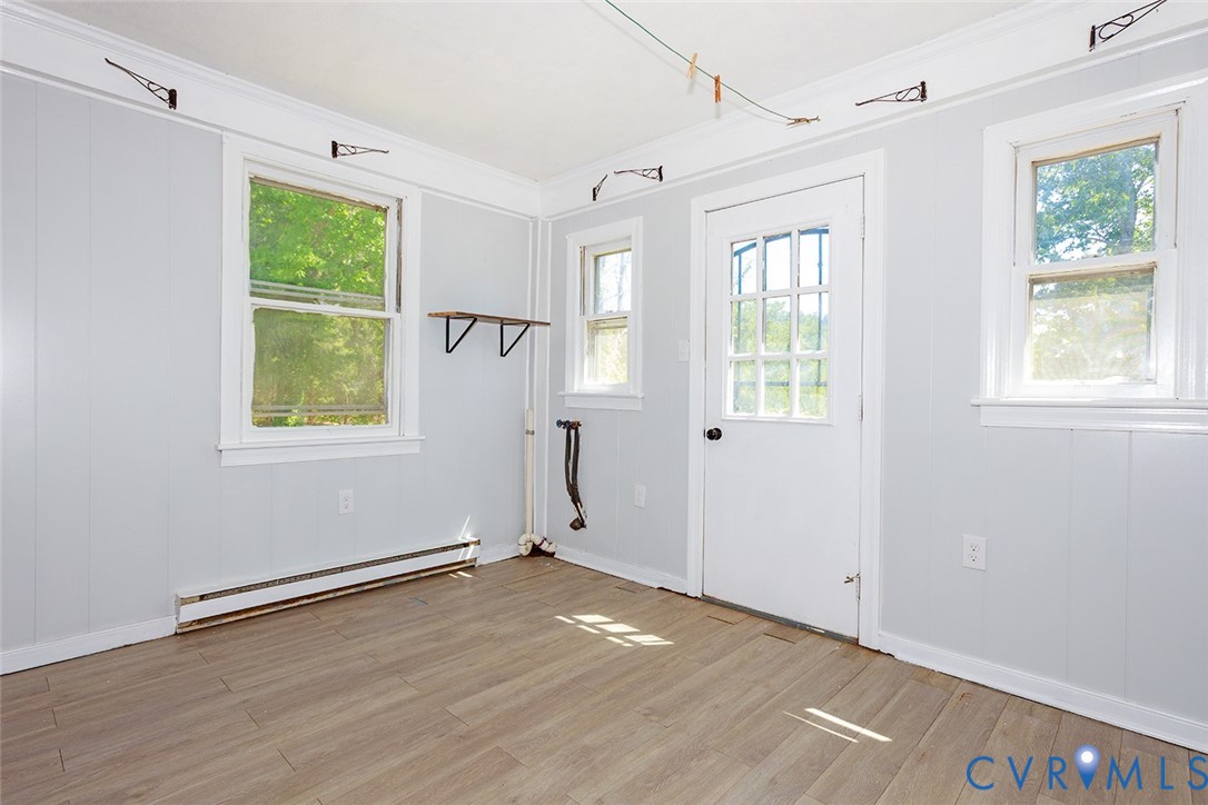 9903 Boze Road Ford, VA 23850 - Photo 7 of 45 an empty room with wooden floor and windows