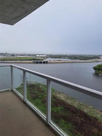 a view of a balcony with lake view and mountain view