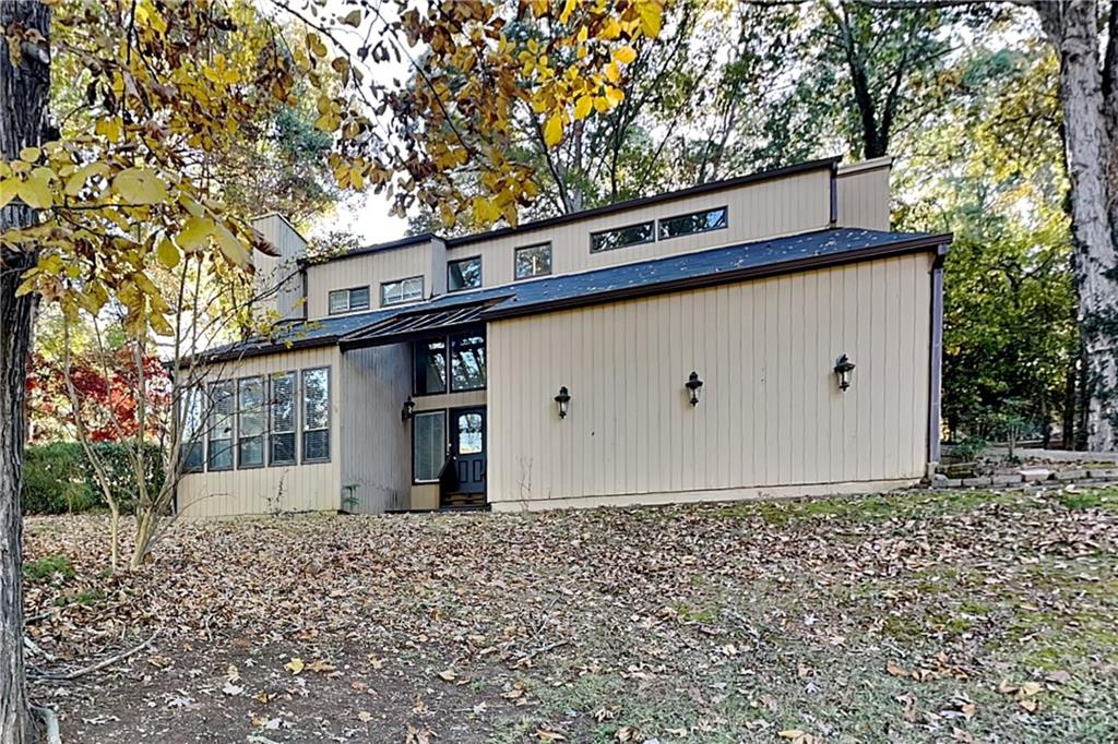 a view of a house with a bunch of trees