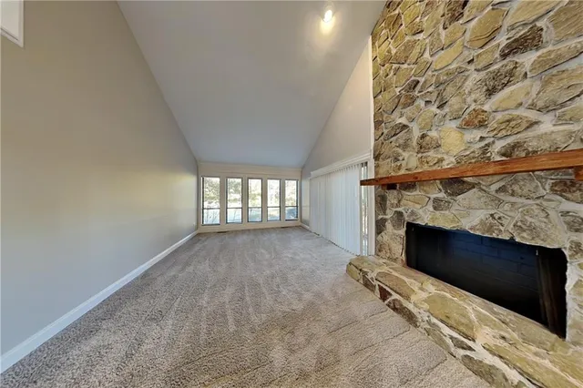 an empty room with a fireplace