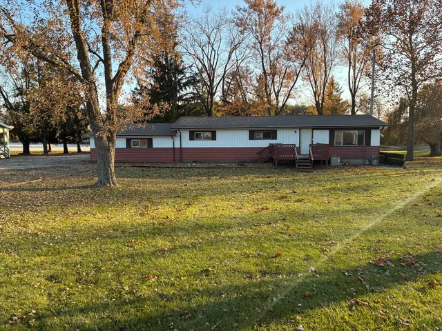 a kitchen with granite countertop a sink and a stove top oven
