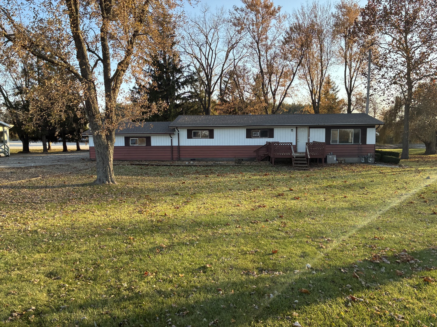 315 East Corning Road Beecher, IL 60401 - Photo 1 of 16 a house that has a tree in front of it