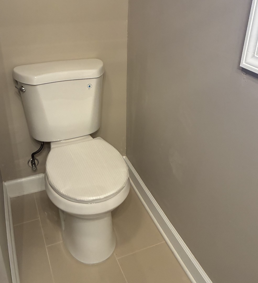 315 East Corning Road Beecher, IL 60401 - Photo 11 of 16 a white toilet sitting next to a white wall