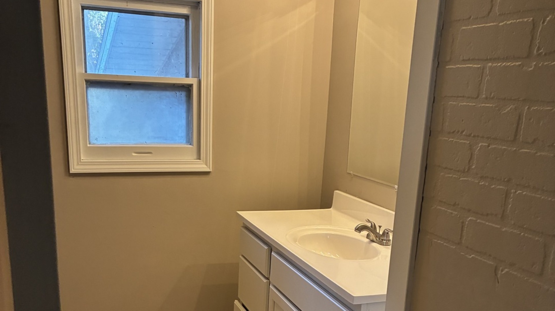 315 East Corning Road Beecher, IL 60401 - Photo 12 of 16 a bathroom with a sink and a mirror