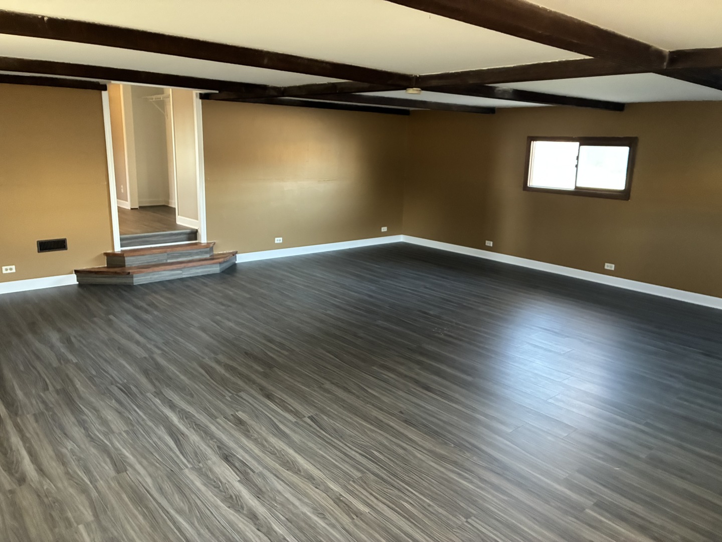 315 East Corning Road Beecher, IL 60401 - Photo 15 of 16 an empty room with wooden floor and windows