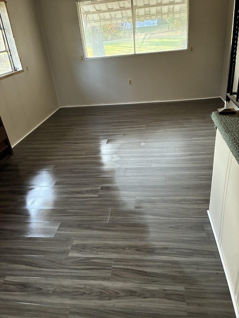 315 East Corning Road Beecher, IL 60401 - Photo 3 of 16 a view of room with window and wooden floor