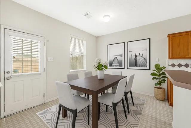 a view of a dining room with furniture window and outside view