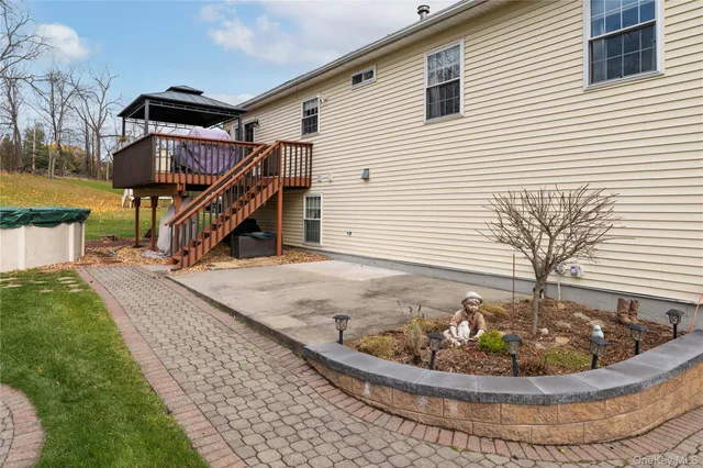 a front view of house with yard and trees