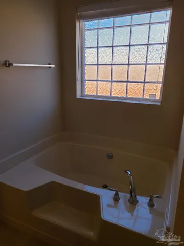 a bathroom with a sink and a window