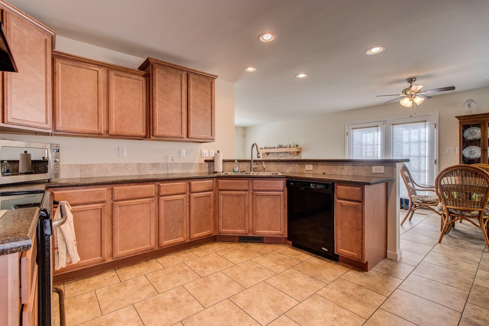 1381 Nemmo Road Vinton, VA 24179 - Photo 12 of 39 a kitchen with stainless steel appliances granite countertop a stove sink and cabinets