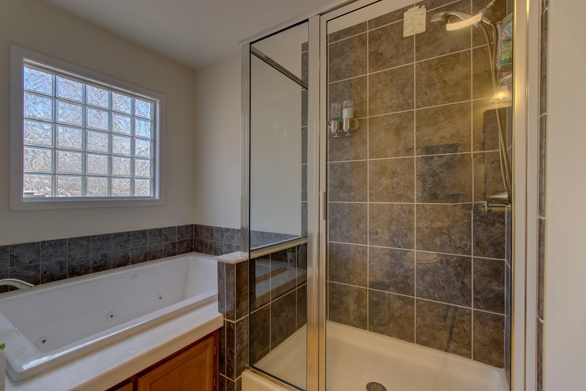 1381 Nemmo Road Vinton, VA 24179 - Photo 18 of 39 a bathroom with a bathtub and a window