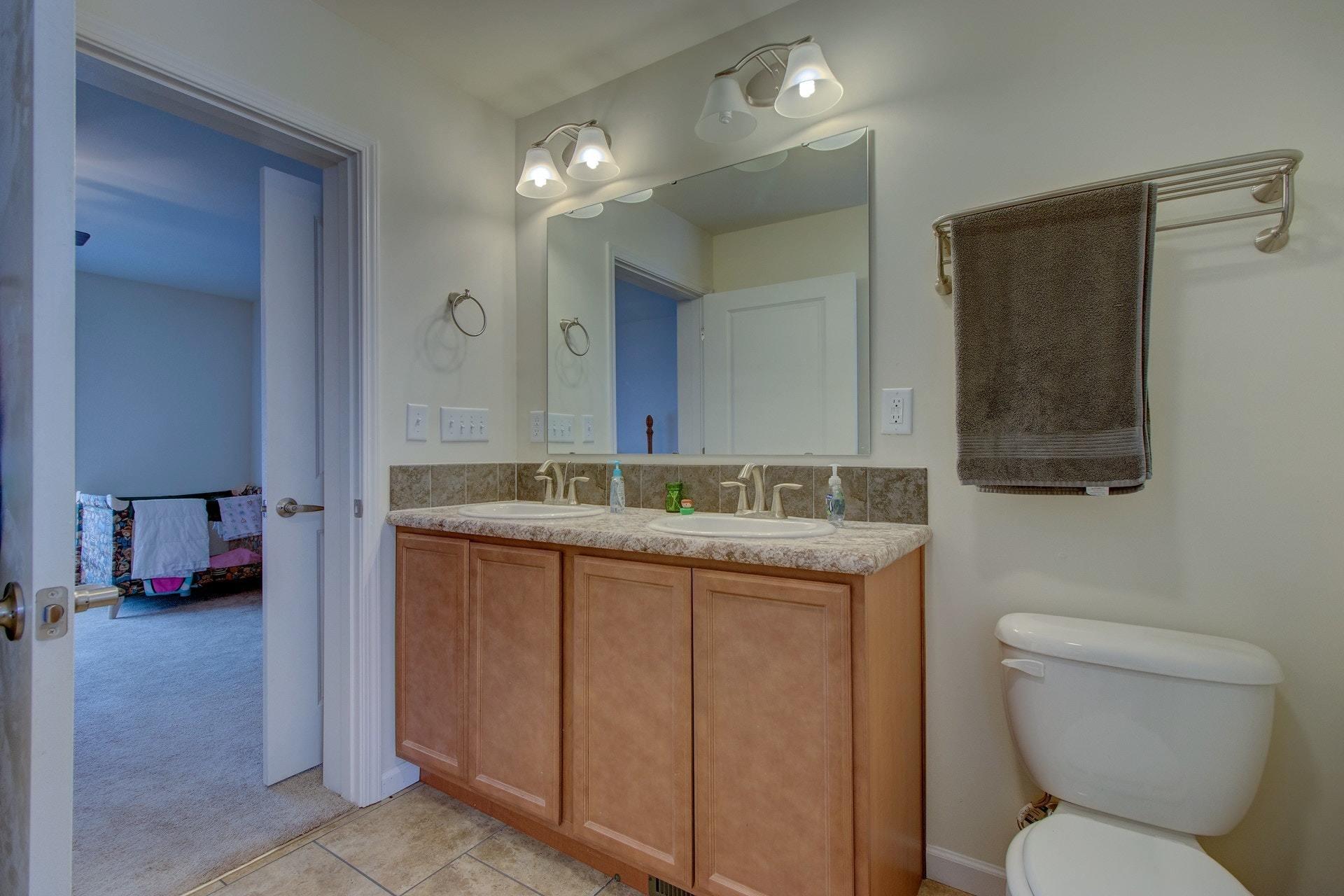 1381 Nemmo Road Vinton, VA 24179 - Photo 20 of 39 a bathroom with a toilet sink and mirror