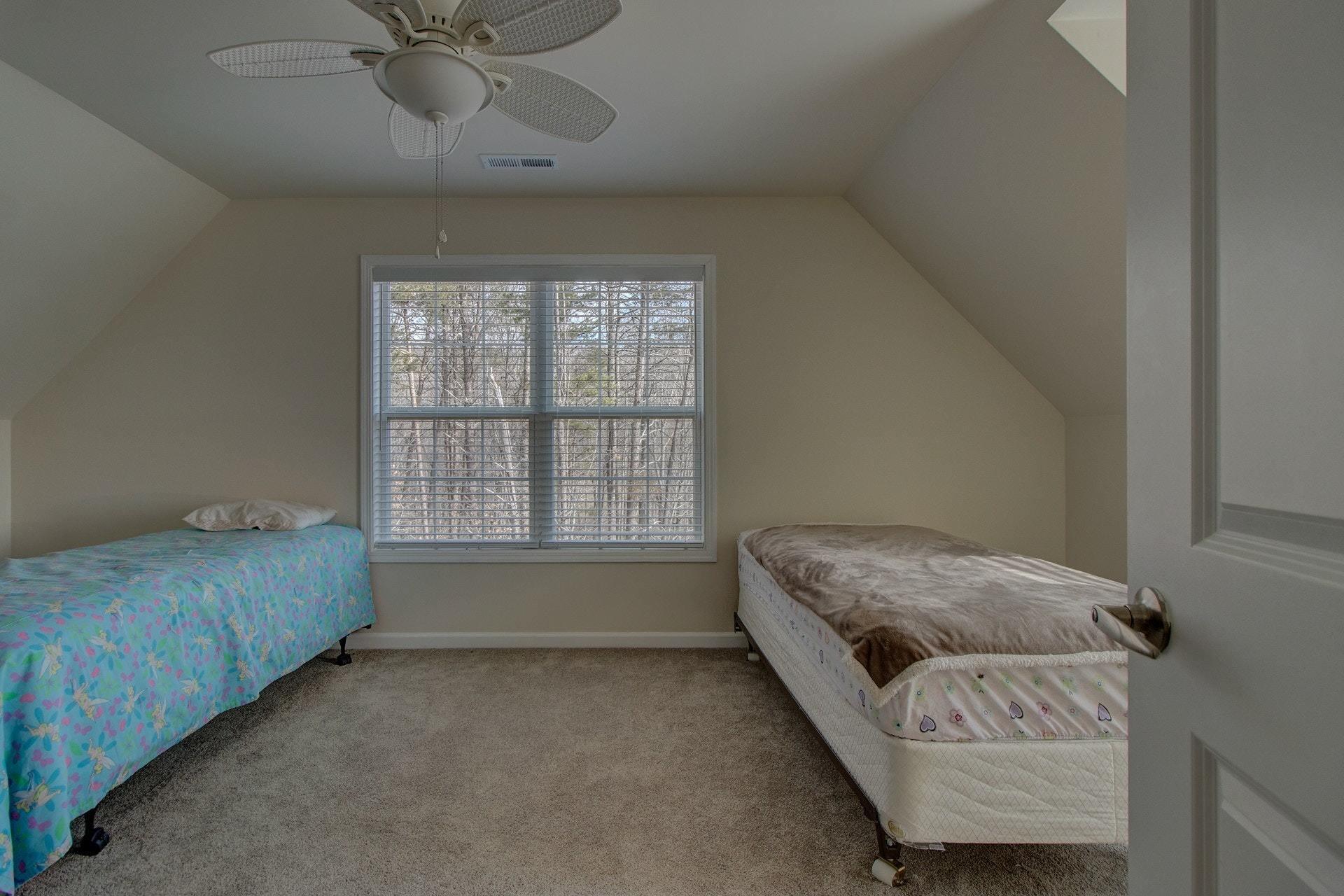 1381 Nemmo Road Vinton, VA 24179 - Photo 27 of 39 a spacious bedroom with a bed and a window