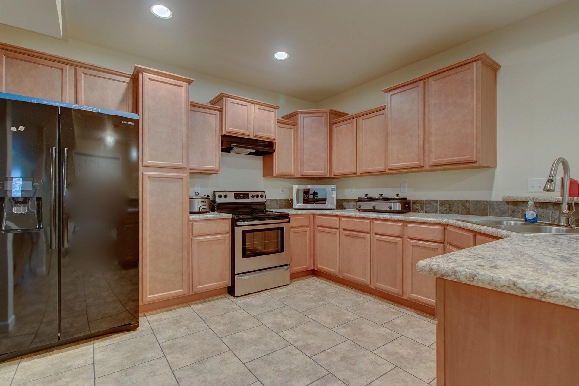 1381 Nemmo Road Vinton, VA 24179 - Photo 29 of 39 a kitchen with granite countertop a refrigerator and a sink