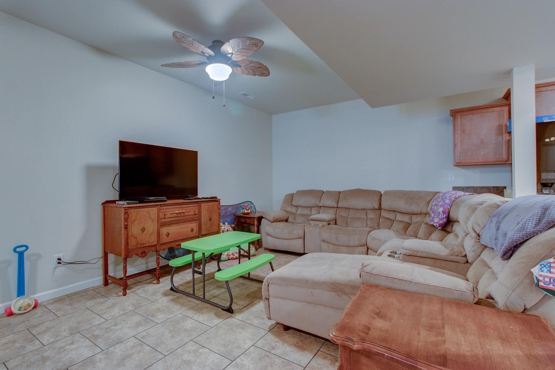 1381 Nemmo Road Vinton, VA 24179 - Photo 32 of 39 a living room with furniture and a flat screen tv