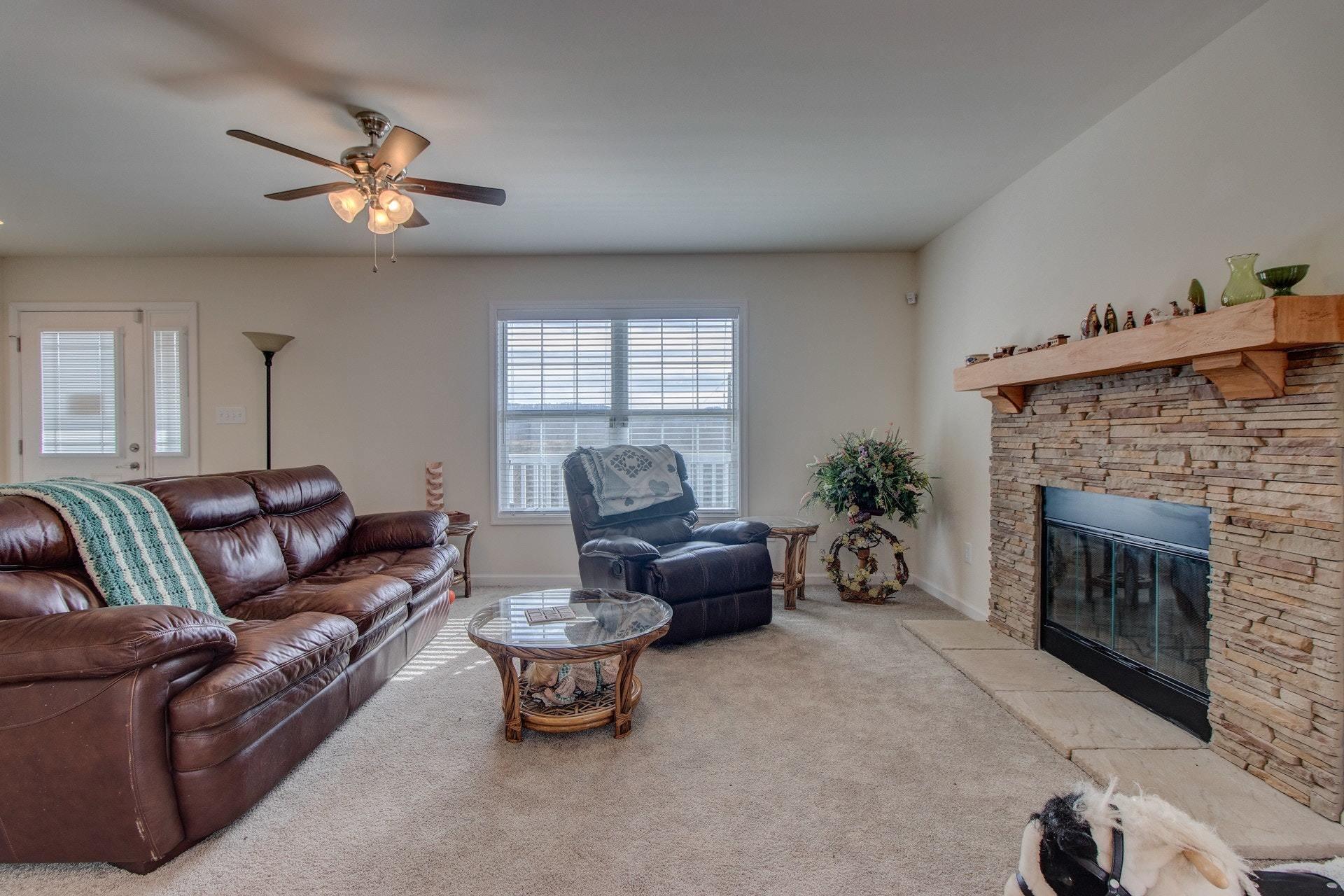 1381 Nemmo Road Vinton, VA 24179 - Photo 6 of 39 a living room with furniture and a fireplace
