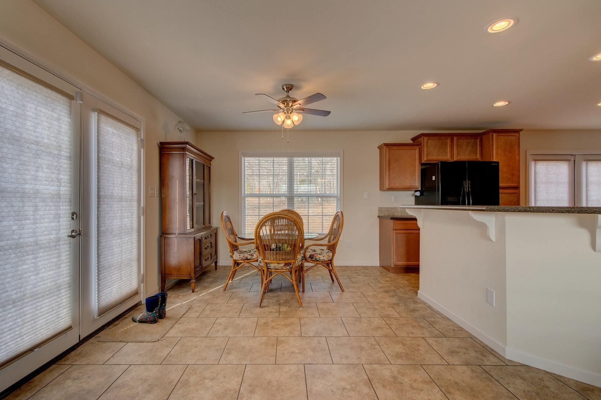 1381 Nemmo Road Vinton, VA 24179 - Photo 9 of 39 a dining room with furniture and chandelier