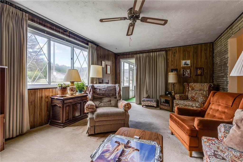 5 Spring Valley Street Slovan, PA 15078 - Photo 11 of 21 Fabulous family room with gas log fireplace. Huge window to watch the weather summer/winter.