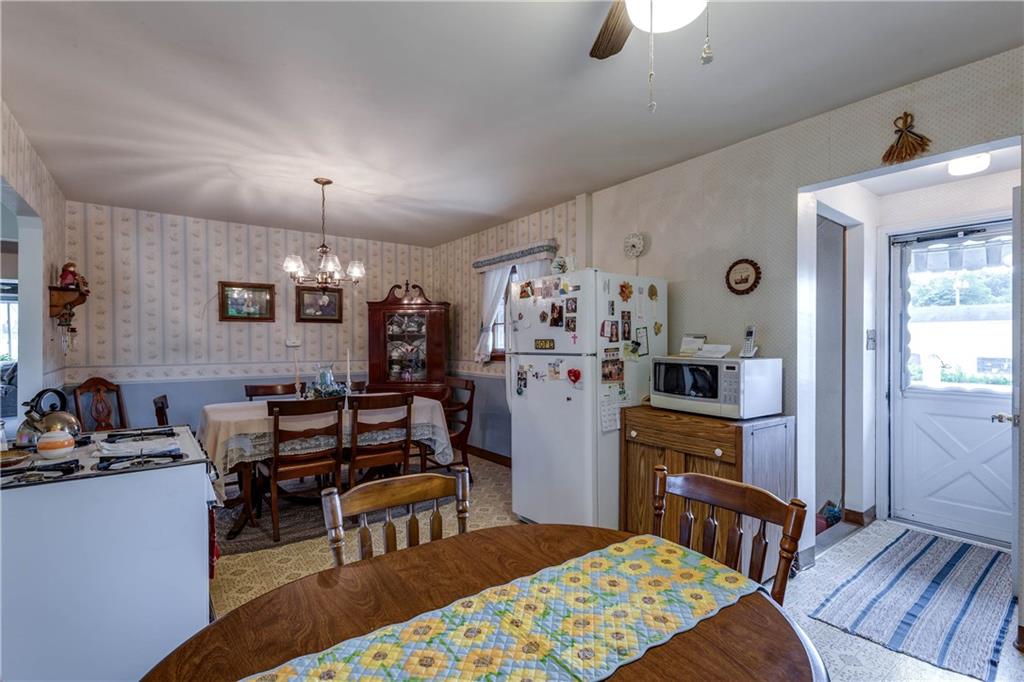 5 Spring Valley Street Slovan, PA 15078 - Photo 6 of 21 Kitchen lots of cabinetry, new counter top, stainless steel sink and faucet. Gas stove, ceiling fan.