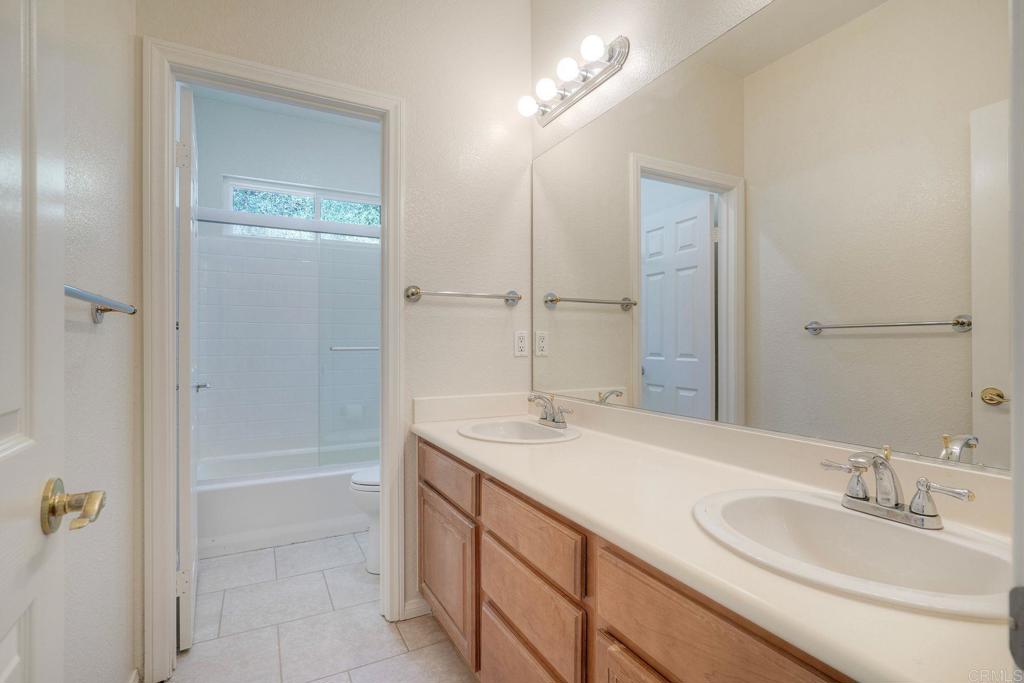 2914 Rancho Rio Chico Carlsbad, CA 92009 - Photo 28 of 37 a bathroom with a sink a vanity and a mirror