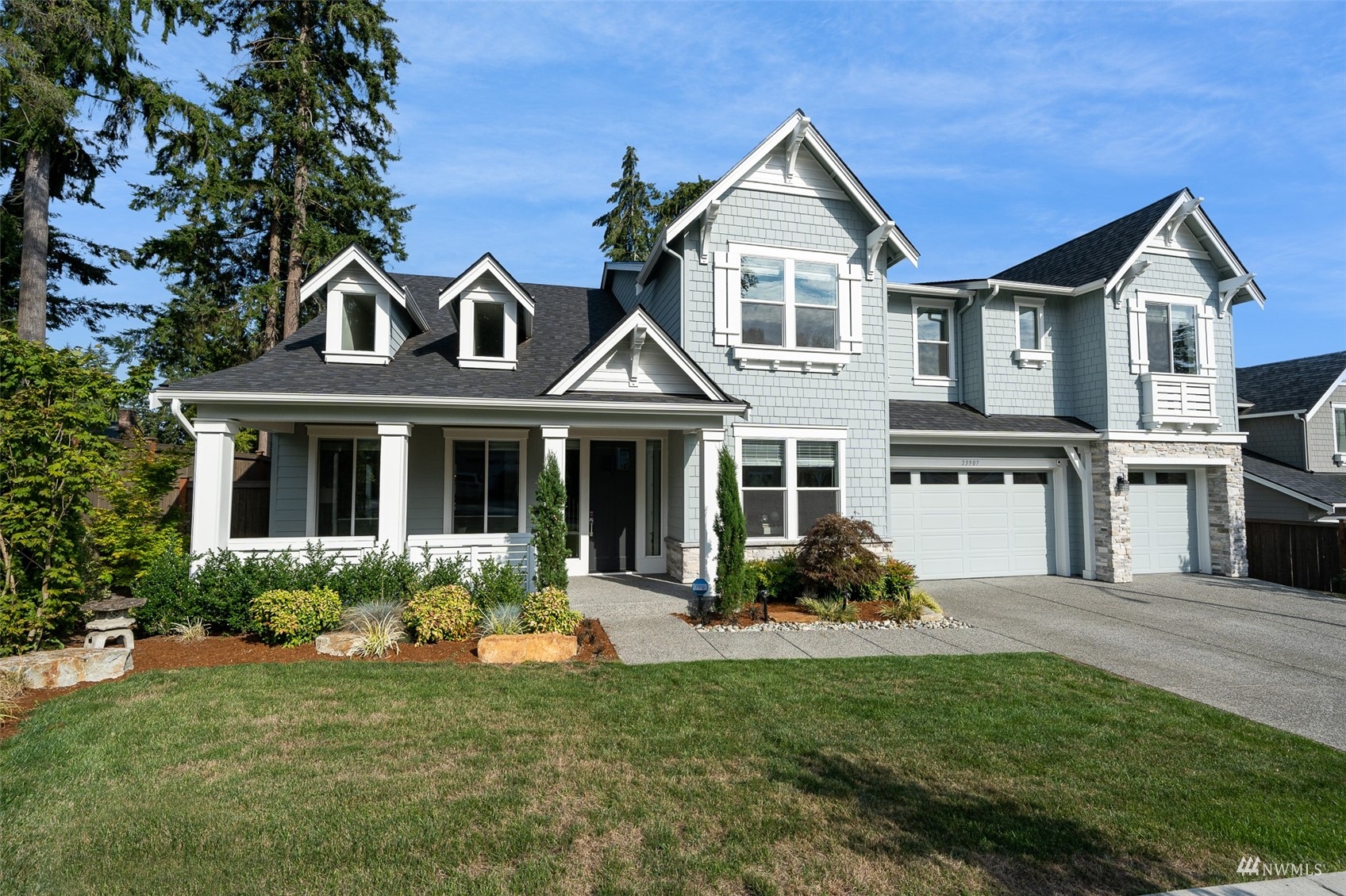 23907 1st Avenue Southeast Bothell, WA 98021 - Photo 1 of 32 a front view of a house with a garden and plants