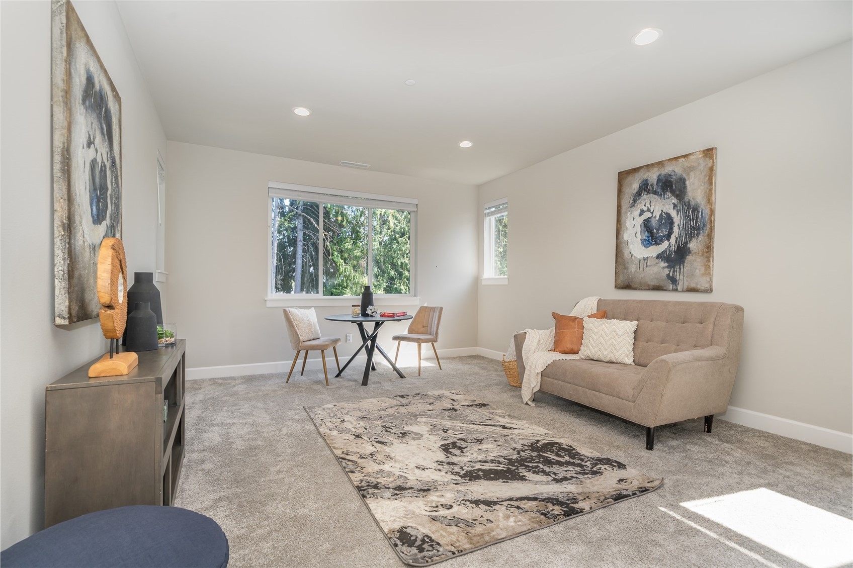 23907 1st Avenue Southeast Bothell, WA 98021 - Photo 28 of 32 a living room with furniture and a flat screen tv