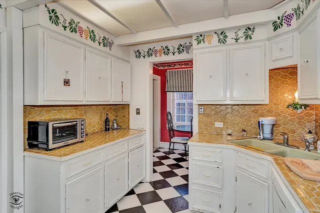 a living room with furniture and flowers
