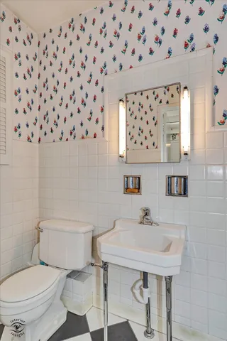 a view of a hallway with wooden floor and stairs
