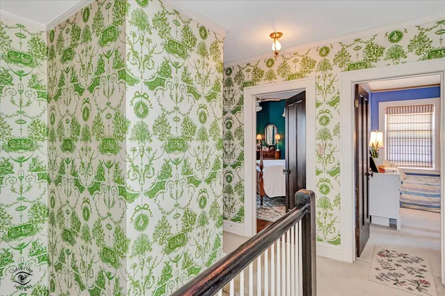 a bedroom with a bed and chandelier