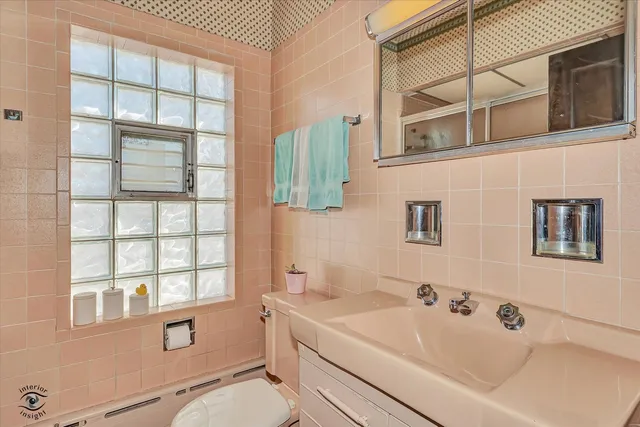 a bathroom with a sink a toilet and tub