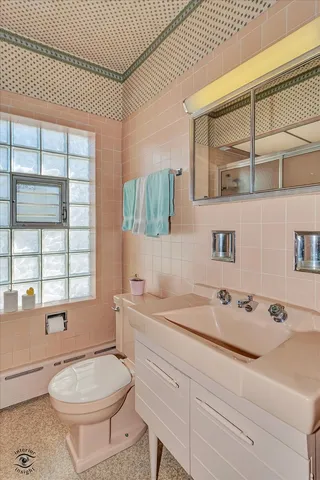 a view of a white house with a snow on the road