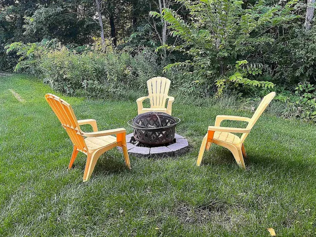 a view of a table and chairs in the garden