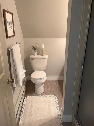 a bathroom with a toilet and a sink