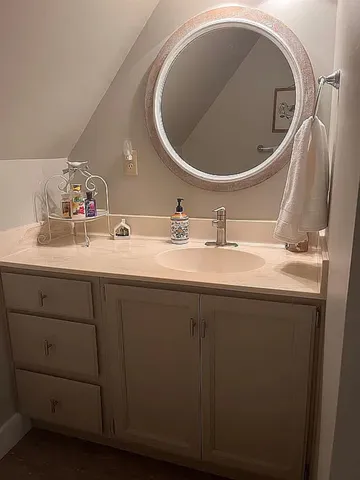 a bathroom with a sink and a mirror