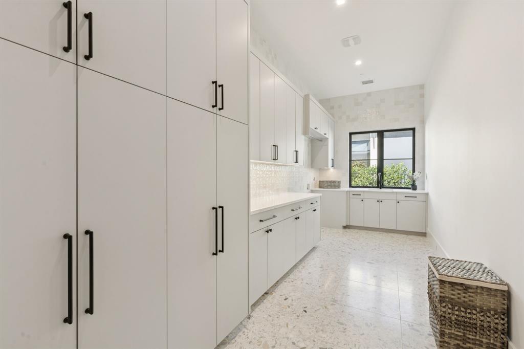 2600 Magnolia Circle Roanoke, TX 76262 - Photo 16 of 39 a large white kitchen with cabinetry and a window