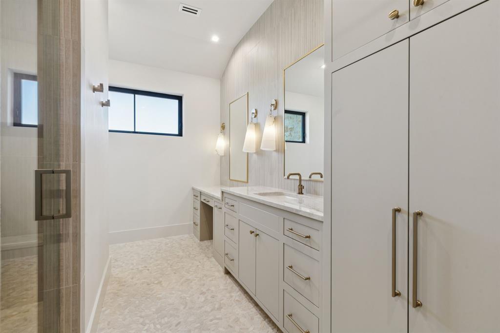 2600 Magnolia Circle Roanoke, TX 76262 - Photo 24 of 39 a spacious bathroom with a double vanity sink a mirror and a shower