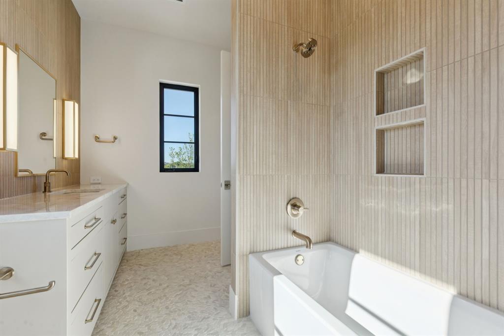 2600 Magnolia Circle Roanoke, TX 76262 - Photo 25 of 39 a bathroom with a tub sink and mirror