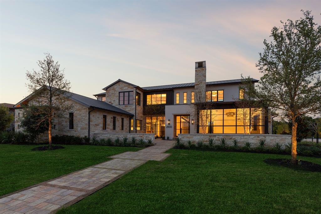 2600 Magnolia Circle Roanoke, TX 76262 - Photo 4 of 39 a front view of a house with a yard and garden