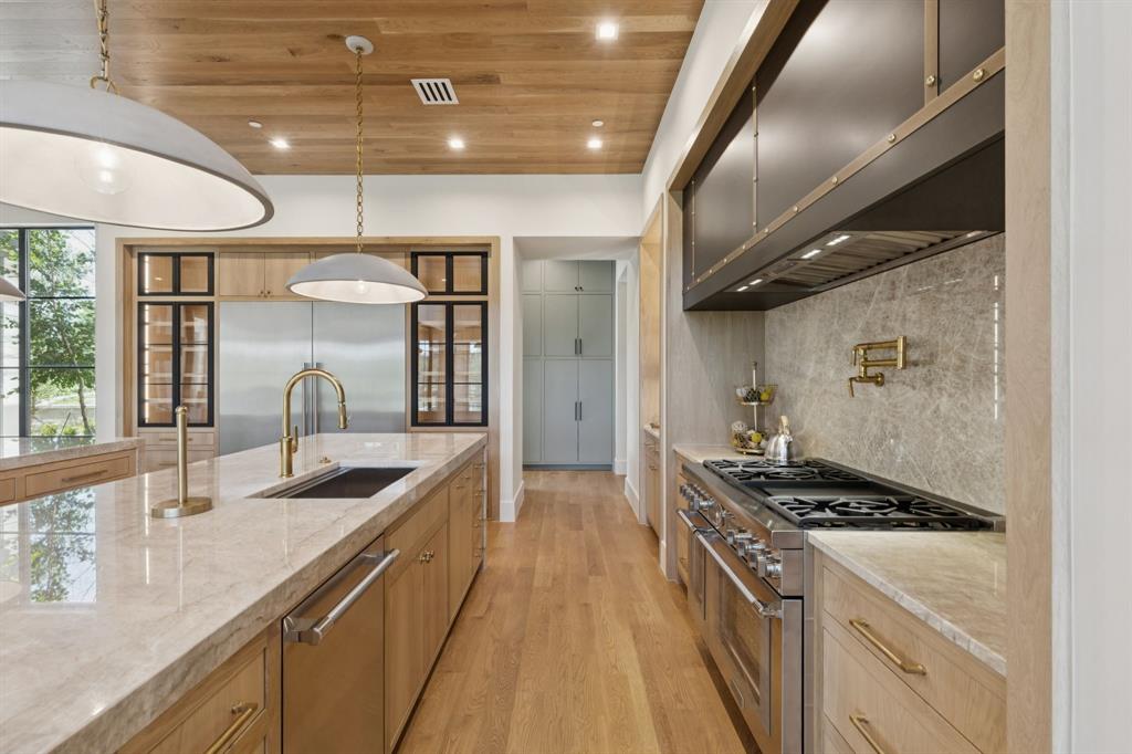 2600 Magnolia Circle Roanoke, TX 76262 - Photo 9 of 39 a kitchen with stainless steel appliances a sink stove and cabinets