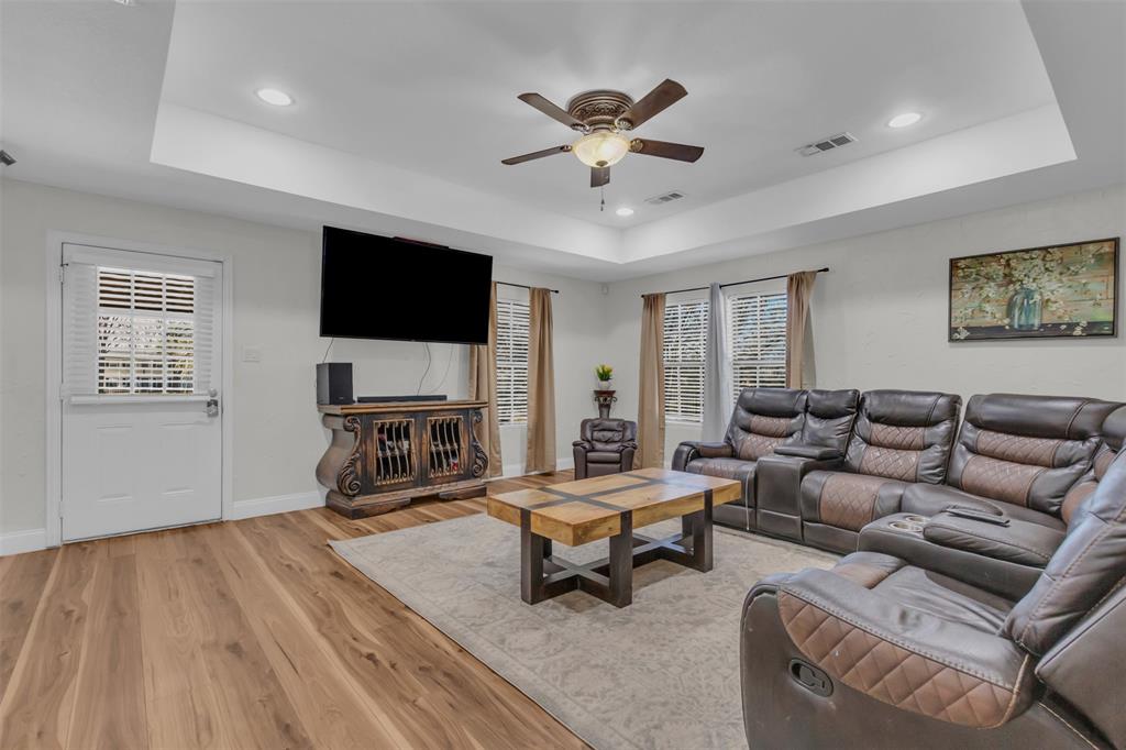 906 Griffith Avenue Terrell, TX 75160 - Photo 11 of 37 a living room with furniture and a flat screen tv