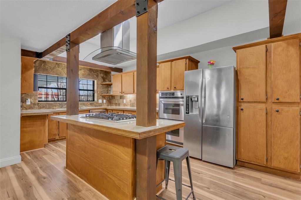 906 Griffith Avenue Terrell, TX 75160 - Photo 16 of 37 a kitchen with stainless steel appliances a refrigerator and a stove