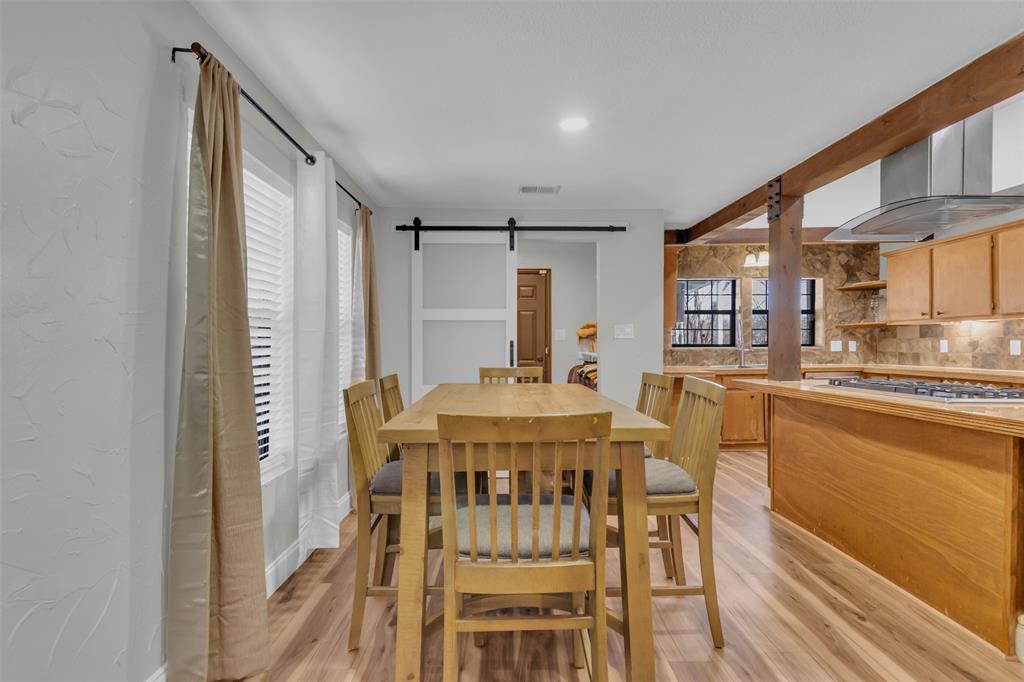906 Griffith Avenue Terrell, TX 75160 - Photo 17 of 37 a view of a dining room with furniture window and wooden floor