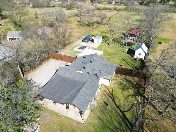 an aerial view of residential houses with outdoor space