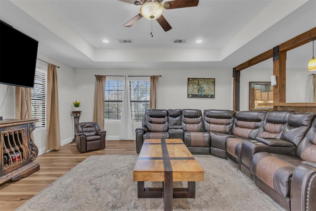 906 Griffith Avenue Terrell, TX 75160 - Photo 10 of 37 a living room with furniture and a flat screen tv