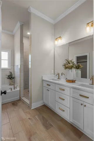a spacious bathroom with a granite countertop sink mirror and shower